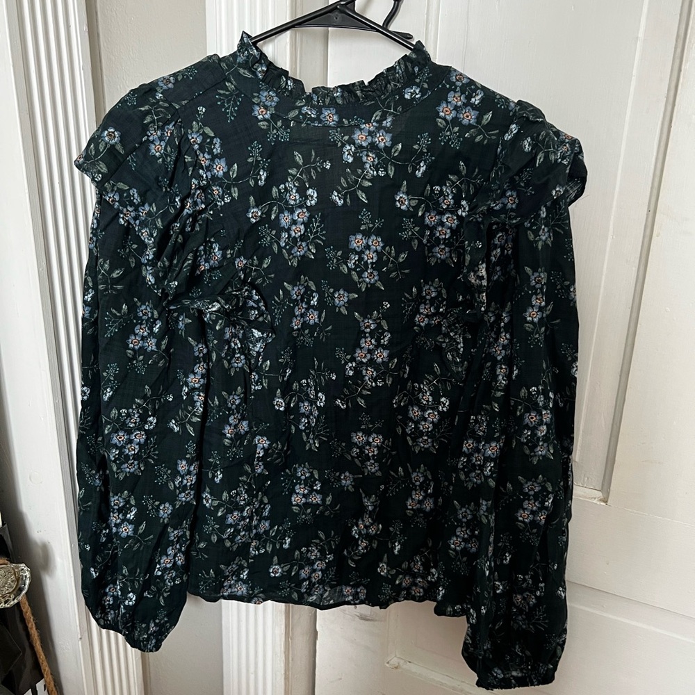High collar floral shirt.